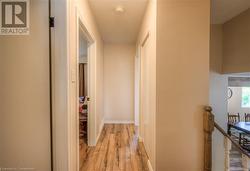 Corridor featuring light hardwood / wood-style floors - 