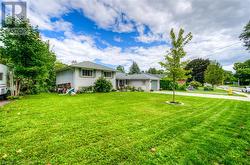 View of front of home featuring a front lawn - 