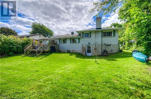 Rear view of house featuring a deck and a yard - 8 Gerrard Avenue, Cambridge, ON - Outdoor