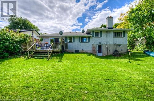 Rear view of house with a lawn and a deck - 8 Gerrard Avenue, Cambridge, ON - Outdoor