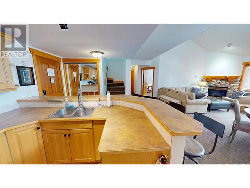 5350 Highline Drive Unit# 2315, Fernie, BC - Indoor Photo Showing Other Room With Fireplace