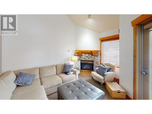 5350 Highline Drive Unit# 2315, Fernie, BC - Indoor Photo Showing Living Room With Fireplace