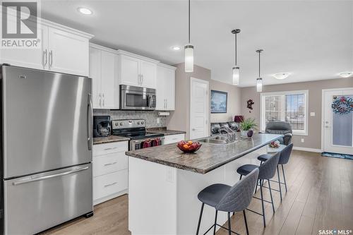 11 4801 Trinity Lane, Regina, SK - Indoor Photo Showing Kitchen With Stainless Steel Kitchen With Double Sink With Upgraded Kitchen