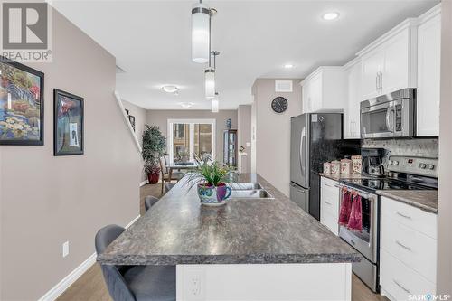 11 4801 Trinity Lane, Regina, SK - Indoor Photo Showing Kitchen With Stainless Steel Kitchen With Double Sink With Upgraded Kitchen