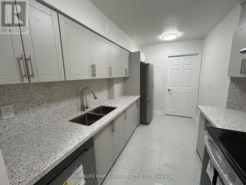 703 - 320 Dixon Road, Toronto, ON - Indoor Photo Showing Kitchen With Double Sink