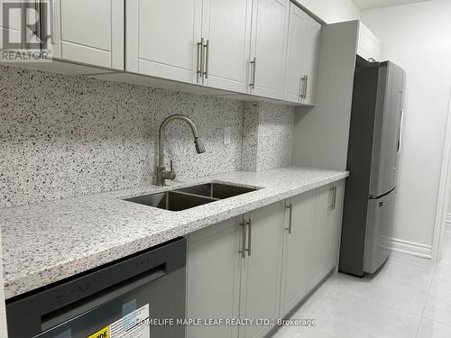 703 - 320 Dixon Road, Toronto, ON - Indoor Photo Showing Kitchen With Double Sink