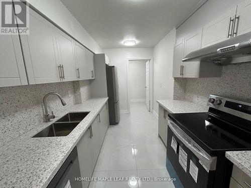 703 - 320 Dixon Road, Toronto, ON - Indoor Photo Showing Kitchen With Double Sink With Upgraded Kitchen