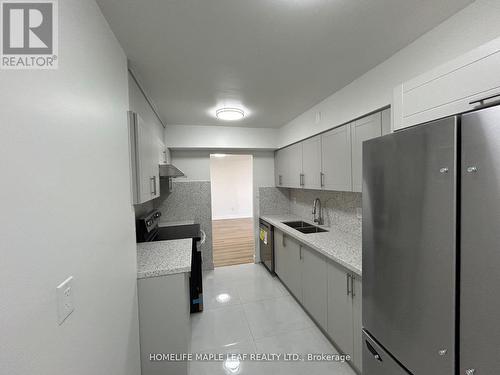 703 - 320 Dixon Road, Toronto, ON - Indoor Photo Showing Kitchen With Double Sink