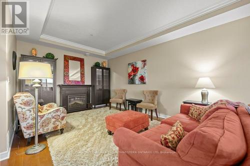 C305 - 65 Bayberry Drive, Guelph, ON - Indoor Photo Showing Living Room With Fireplace