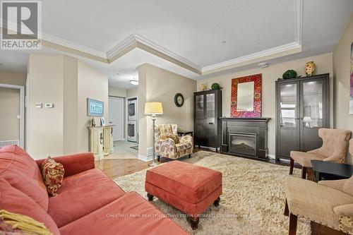 C305 - 65 Bayberry Drive, Guelph, ON - Indoor Photo Showing Living Room With Fireplace