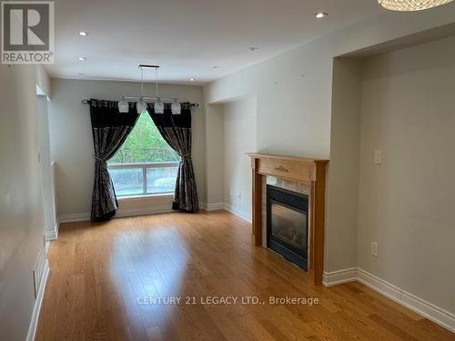 27 - 10 Cherrytree Drive, Brampton, ON - Indoor Photo Showing Living Room With Fireplace