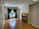 27 - 10 Cherrytree Drive, Brampton, ON  - Indoor Photo Showing Living Room With Fireplace 