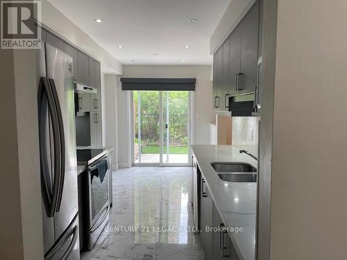 27 - 10 Cherrytree Drive, Brampton, ON - Indoor Photo Showing Kitchen With Stainless Steel Kitchen With Double Sink With Upgraded Kitchen