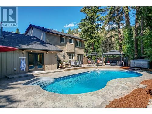 827 Coronado Court, Kelowna, BC - Outdoor With In Ground Pool With Deck Patio Veranda With Backyard