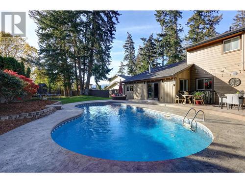 827 Coronado Court, Kelowna, BC - Outdoor With In Ground Pool With Deck Patio Veranda With Backyard