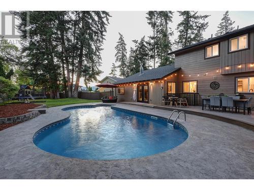 827 Coronado Court, Kelowna, BC - Outdoor With In Ground Pool With Deck Patio Veranda With Backyard