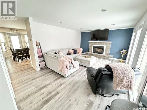 602 Brimacombe Drive, Weyburn, SK - Indoor Photo Showing Living Room With Fireplace