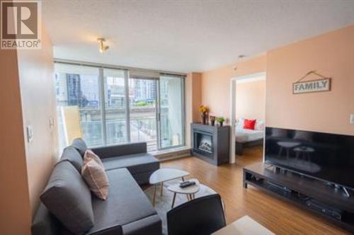 506 689 Abbott Street, Vancouver, BC - Indoor Photo Showing Living Room With Fireplace