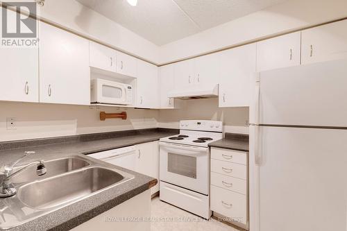 306 - 1460 Bishops Gate, Oakville, ON - Indoor Photo Showing Kitchen With Double Sink