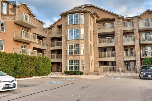 306 - 1460 Bishops Gate, Oakville, ON - Outdoor With Facade