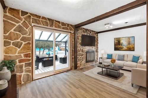 10 Rowe Street, Winnipeg, MB - Indoor Photo Showing Living Room With Fireplace