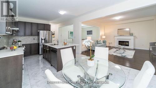 15 Neil Promenade, Caledon, ON - Indoor Photo Showing Kitchen With Fireplace