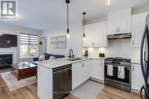 9 Corbett Street, Port Hope, ON - Indoor Photo Showing Kitchen With Fireplace With Stainless Steel Kitchen With Double Sink With Upgraded Kitchen