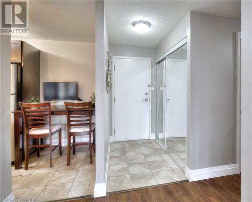 Entryway with light hardwood / wood-style floors and a textured ceiling - 276 Eiwo Court Unit# 105, Waterloo, ON - Indoor Photo Showing Other Room