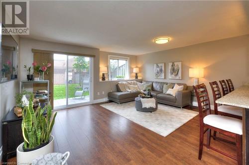 Living room featuring wood-type flooring - 276 Eiwo Court Unit# 105, Waterloo, ON - Indoor Photo Showing Living Room