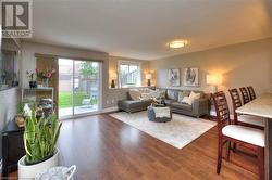 Living room featuring wood-type flooring - 