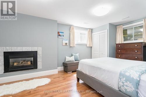 795744 Grey Road 19, Blue Mountains, ON - Indoor Photo Showing Bedroom With Fireplace