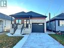 View of front of house with covered porch and a garage - 53 Giles Street, London, ON  - Outdoor 