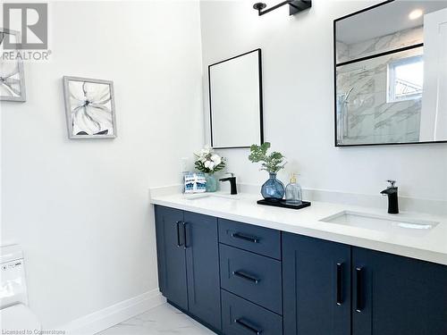 Bathroom with vanity and a shower with shower door - 53 Giles Street, London, ON - Indoor Photo Showing Bathroom