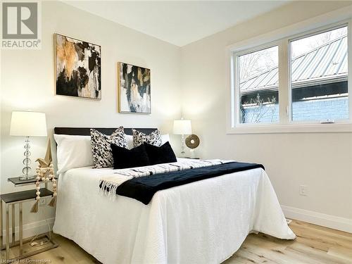 Bedroom featuring wood-type flooring - 53 Giles Street, London, ON - Indoor Photo Showing Bedroom