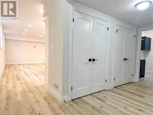 Corridor with light wood-type flooring - 53 Giles Street, London, ON - Indoor Photo Showing Other Room