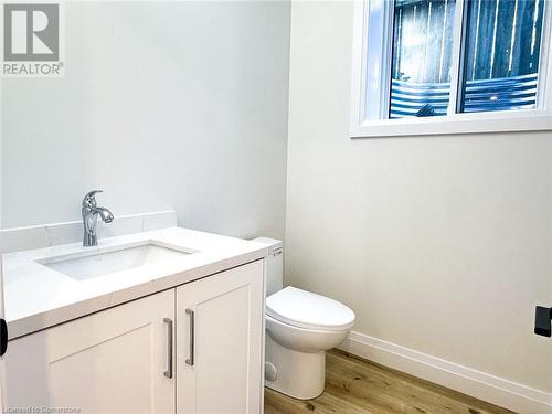 Bathroom featuring hardwood / wood-style floors, vanity, and toilet - 53 Giles Street, London, ON - Indoor Photo Showing Bathroom