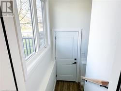 Entryway with dark wood-type flooring - 