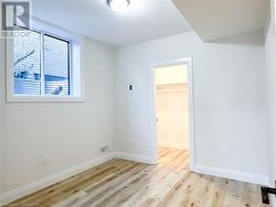 Empty room featuring light wood-type flooring - 