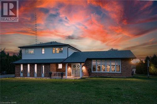 View of front of property with a lawn and covered porch - 9202 9Th Line, Halton Hills, ON - Outdoor With Deck Patio Veranda