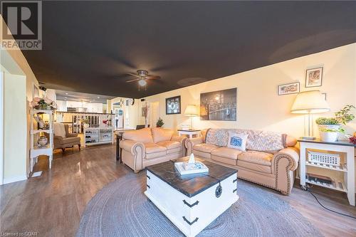 Living room with hardwood / wood-style floors and ceiling fan - 9202 9Th Line, Halton Hills, ON - Indoor Photo Showing Living Room