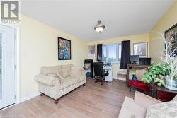 Home office with hardwood / wood-style floors and a textured ceiling - 