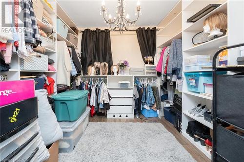 Walk in closet with hardwood / wood-style floors and a chandelier - 9202 9Th Line, Halton Hills, ON - Indoor With Storage