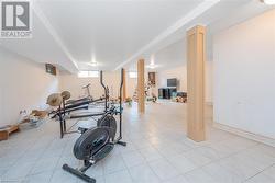 Workout room featuring light tile patterned flooring - 