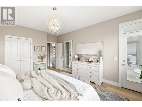 Primary Bedroom w/ walk-in Closet - 1072 Aurora Heights, West Kelowna, BC - Indoor Photo Showing Bedroom