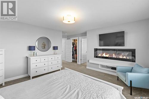 519 Secord Manor, Saskatoon, SK - Indoor Photo Showing Bedroom With Fireplace