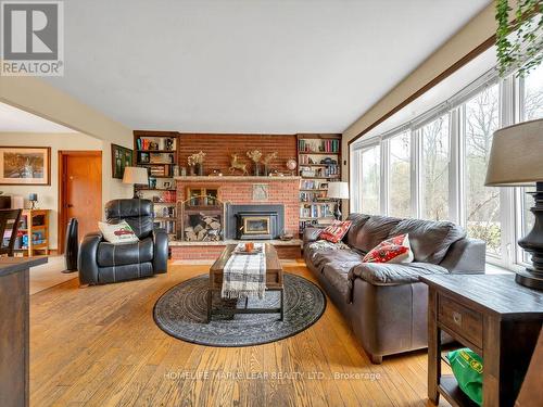 2009 Sideroad 10, Milton, ON - Indoor Photo Showing Living Room With Fireplace