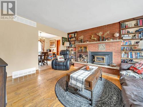 2009 Sideroad 10, Milton, ON - Indoor Photo Showing Living Room With Fireplace