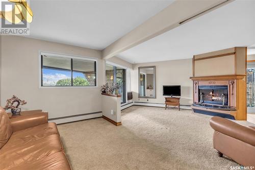 101 222 Saskatchewan Crescent E, Saskatoon, SK - Indoor Photo Showing Other Room With Fireplace