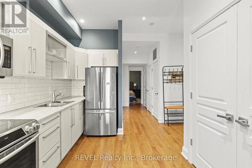 202 - 3710 Main Street, Niagara Falls (223 - Chippawa), ON - Indoor Photo Showing Kitchen With Double Sink