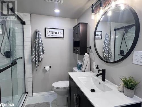 Bathroom featuring vanity, an enclosed shower, and toilet - 80 Ridley Street, Prince Edward County, ON - Indoor Photo Showing Bathroom